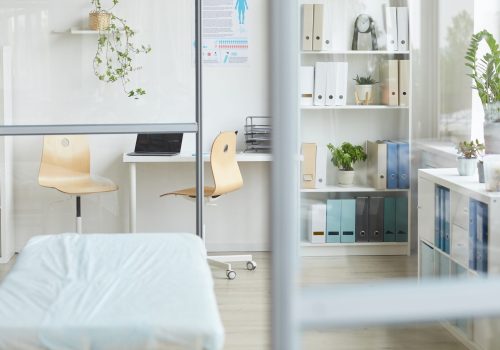 Horizontal no people shot of modern doctor's office interior in hospital in daylight, copy space