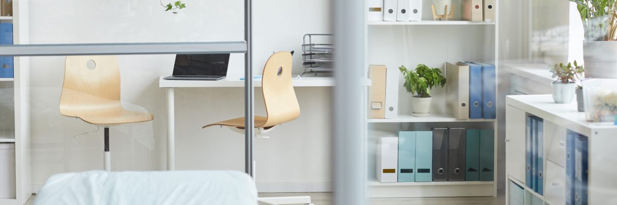 Horizontal no people shot of modern doctor's office interior in hospital in daylight, copy space