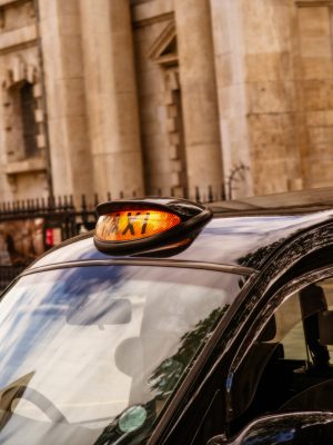 A view of London black cab taxi for hire around Trafalgar square