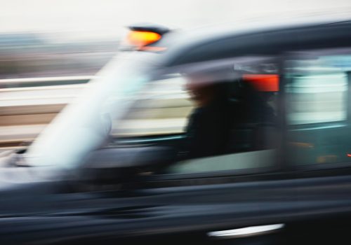 Daily life in the city. Taxi car in blurred motion. London, The United Kingdom of Great Britain and Northern Ireland